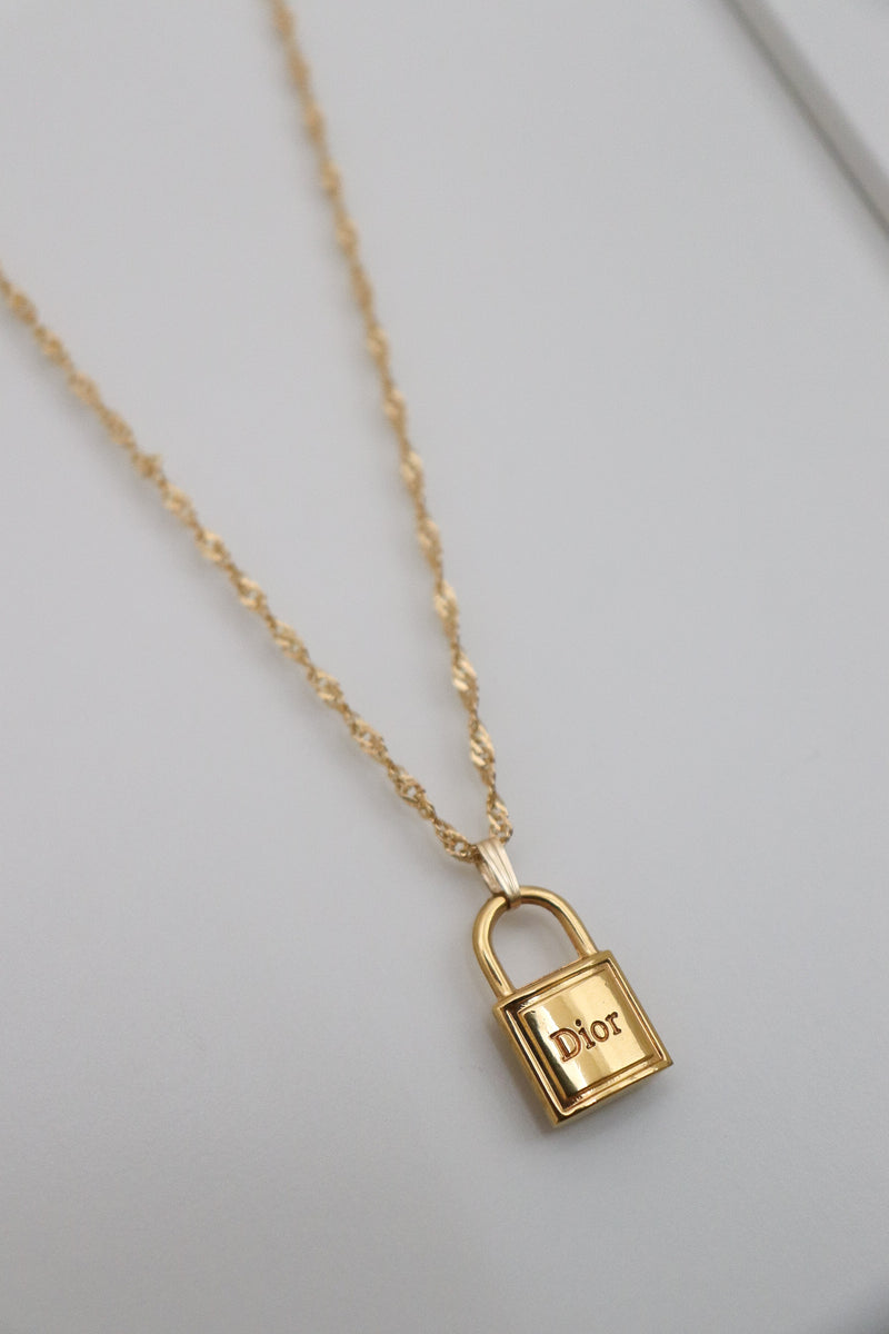 Gold dior clearance lock necklace