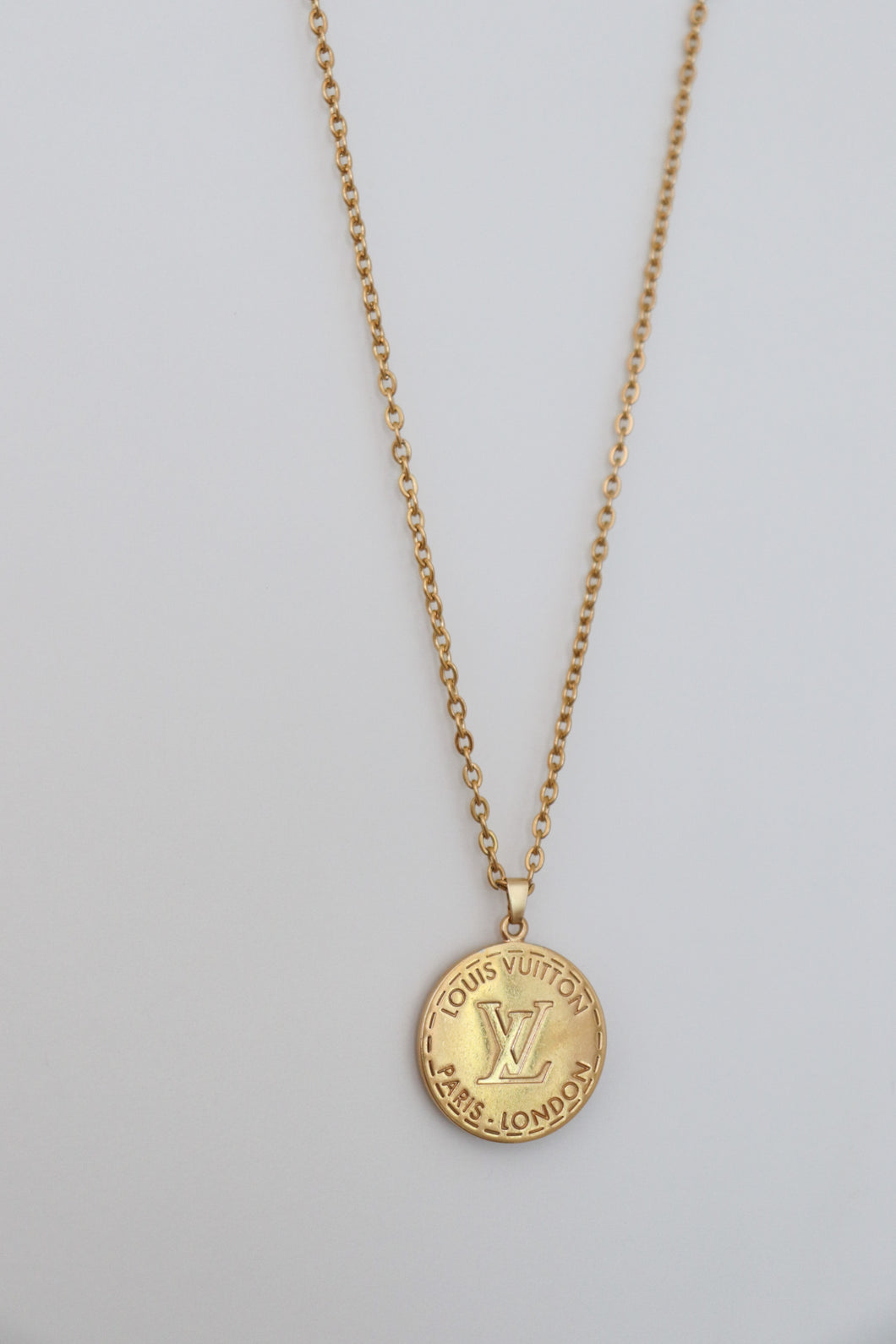 Louis Vuitton double sided golden pendant